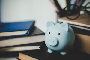 close-up education object with stack money coin-cash dollar and glass jar on background. Concept to saving money income for study, Calculating student finance costs and investment budget loan photo