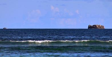 Stunning indian ocean waves at the beaches on the paradise island seychelles photo