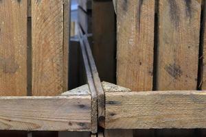 Very old wooden crates with some cracks in a close up view photo