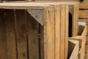 Very old wooden crates with some cracks in a close up view photo