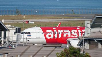 PHUKET, THAILAND DECEMBER 3, 2018 - AirAsia Airbus A320 HS BBH pushing back before departure. video