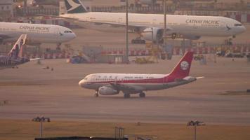 HONG KONG NOVEMBER 7, 2019 - Sichuan Airlines Airbus A320 B 6410 taxiing before departure at sunset. Chek Lap Kok international airport, Hong Kong video