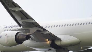 AMSTERDAM, THE NETHERLANDS JULY 27, 2017 - Air France Airbus 320 F GKXI climbing and retracting landing gear after take off from Shiphol Airport, Amsterdam, in the rain video