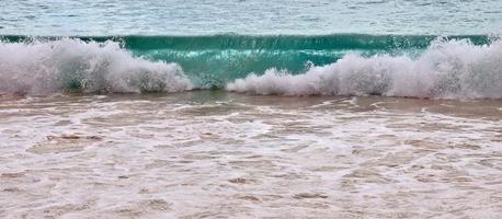 Stunning indian ocean waves at the beaches on the paradise island seychelles photo