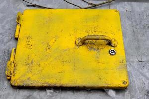 Metallic cover of a big trash can with a handle. photo