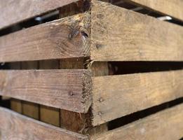 Very old wooden crates with some cracks in a close up view photo