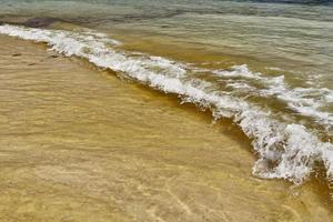 Stunning indian ocean waves at the beaches on the paradise island seychelles photo