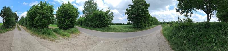 Panorama of countryside roads with fields and trees in northern europe. photo