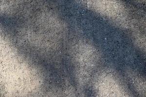 Detailed close up view on pebbles and stones on a gravel ground texture photo