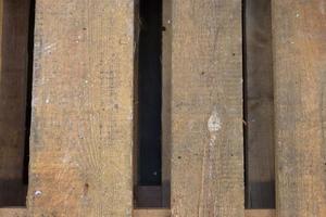 Very old wooden crates with some cracks in a close up view photo