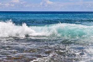 Stunning indian ocean waves at the beaches on the paradise island seychelles photo