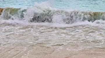 Stunning indian ocean waves at the beaches on the paradise island seychelles photo
