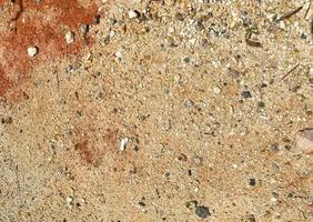 Detailed close up view on pebbles and stones on a gravel ground texture photo