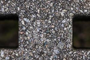 Detailed close up view on pebbles and stones on a gravel ground texture photo