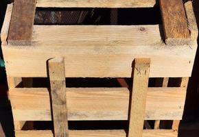 Very old wooden crates with some cracks in a close up view photo