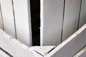 Very old wooden crates with some cracks in a close up view photo