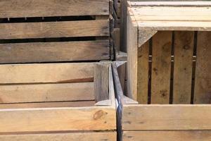Very old wooden crates with some cracks in a close up view photo