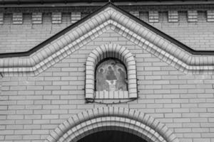 Christian church cross in high steeple tower for prayer photo