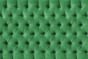 Green capitone velours textile decoration with buttons photo