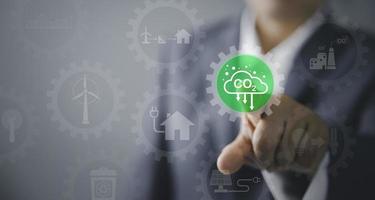 Sustainable development and innovation green business concept. Businesswoman working virtual globe modern computer to reduce CO2 emissions carbon footprint climate change to limit global warming. photo