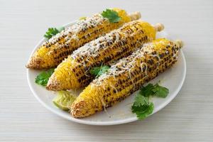 barbecue and grilled corn with cheese and lime photo