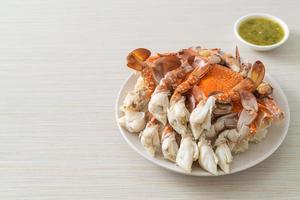 Steamed blue crab with spicy seafood sauce photo