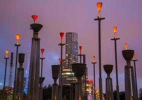 Melbourne, Australia - May 10 2015 - Eureka tower the tallest building in Melbourne view from Birrarung Marr with Federation Bells a set of 39 bronze bells located in central Melbourne. photo