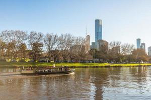 Melbourne, Australia - October 14 2015 - Tourist traveling by boat along the Yarra river to see the view of Melbourne the most liveable city in the world. photo
