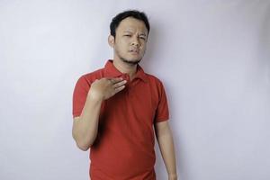 Attractive Asian man with hand gesture pose rejection or prohibition with copy space photo