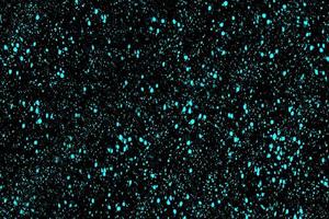 Winter abstract texture with falling snow. Flying particles on a black background. Splash spray, confetti. photo