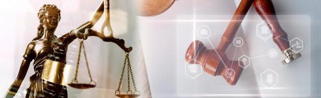 Justice and law concept.Male judge in a courtroom with the gavel, working with, computer and docking keyboard, eyeglasses, on table in morning light photo
