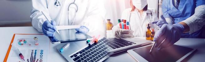 Medicine doctor hand working on a patients x-ray scans digital healthcare and connection with modern virtual screen interface icons, Medical technology and network concept. photo