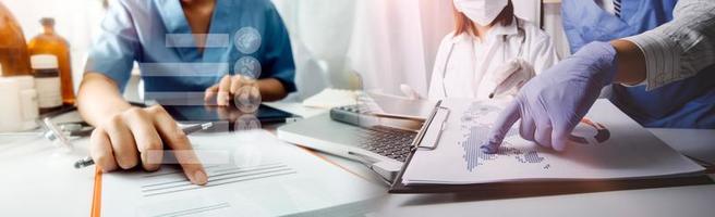 Medicine doctor hand working on a patients x-ray scans digital healthcare and connection with modern virtual screen interface icons, Medical technology and network concept. photo