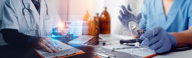 Medicine doctor hand working on a patients x-ray scans digital healthcare and connection with modern virtual screen interface icons, Medical technology and network concept. photo