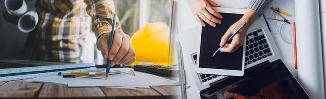 Two colleagues discussing data working and tablet, laptop with on on architectural project at construction site at desk in office photo