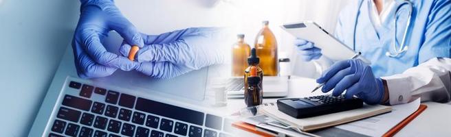 Medicine doctor hand working on a patients x-ray scans digital healthcare and connection with modern virtual screen interface icons, Medical technology and network concept. photo
