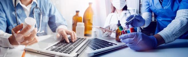 Medicine doctor hand working on a patients x-ray scans digital healthcare and connection with modern virtual screen interface icons, Medical technology and network concept. photo