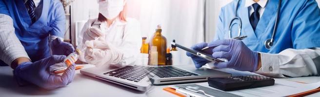 Medicine doctor hand working on a patients x-ray scans digital healthcare and connection with modern virtual screen interface icons, Medical technology and network concept. photo
