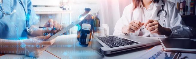 Medicine doctor hand working on a patients x-ray scans digital healthcare and connection with modern virtual screen interface icons, Medical technology and network concept. photo