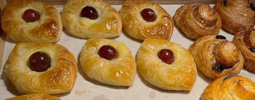 freshly baked danish pastry with apricot jam fruity jelly super delicious warm fresh buttery baked pastries with apricot and peach photo