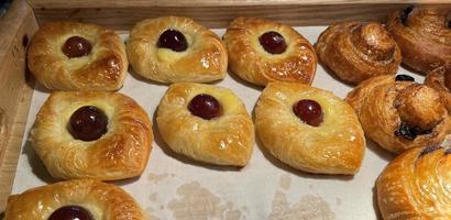 freshly baked danish pastry with apricot jam fruity jelly super delicious warm fresh buttery baked pastries with apricot and peach photo