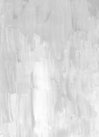 Abstract white textured background. Light monochrome backdrop. Gray and white painting. Brush strokes on paper. photo