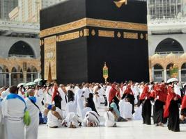 Mecca, Saudi Arabia, Sep 2022 - Pilgrims from other countries are busy praying near the Kaaba in Masjid al-Haram in Mecca. photo