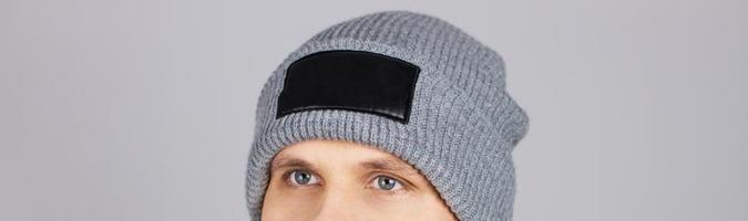 man in grey hat isolated, hipster in empty winter hat,copy space,mock up - cropped image photo