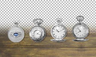 Set of old pocket watches isolated on wooden background. photo