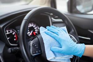 Staff is cleaning the inside of the car  to prevent corona virus. photo