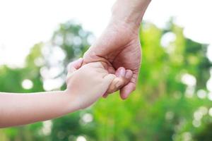 Children's hands with the warmth of mother's care photo