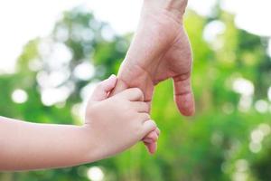 Children's hands with the warmth of mother's care photo