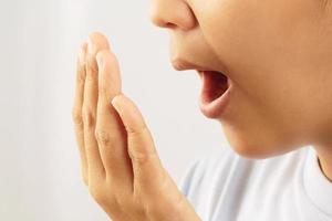 Women have bad breath caused by swollen gums. photo