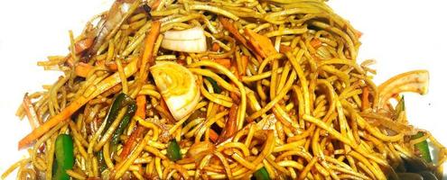 Schezwan Noodles or vegetable Hakka Noodles or chow mein is a popular Indo-Chinese recipes, served in a bowl or plate photo